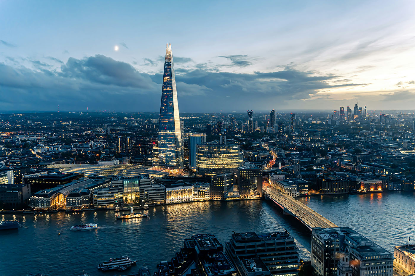 London skyline featuring The Shard at dusk over the River Thames